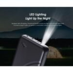 Compact black wireless earbud charging case with earbuds placed beside it